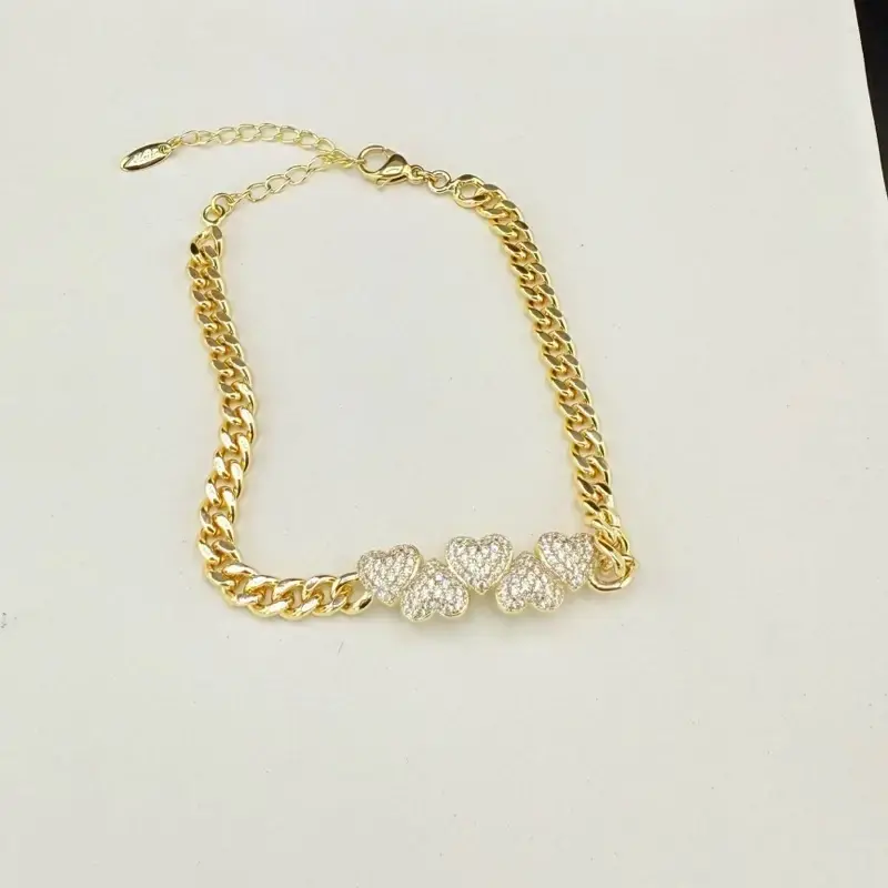 Women's Bracelet with Hearts Decorated with Zircons, 7 Inches Long with 2 Inches Extension, Gold Finish