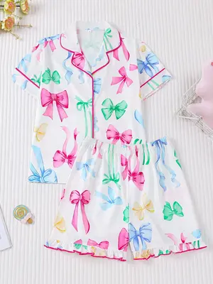 2 Pieces Of Girls' Colorful Bow Printed Short Sleeved Shorts Sleepwear Set with Buttons and Elastic Waistband, Suitable for A...