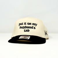 Put it on my Husband's Tab Trucker Hat by The Mad Hatter Company