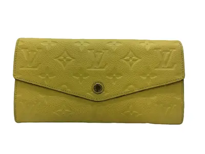 Pre-owned Louis Vuitton Leather Small Leather Goods Monogram Empreinte Sarah Wallet in Yellow