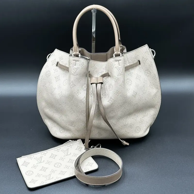 Pre-owned Louis Vuitton Mahina Leather Tote Bags Mahina Girolata Galet MM Tote Bag in Beige with Drawstring Closure