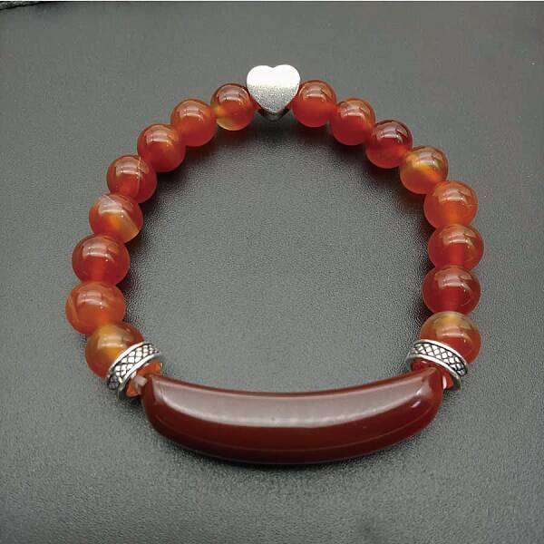 Fashionable crystal tiger eye hand bracelet with red agate heart pendant.