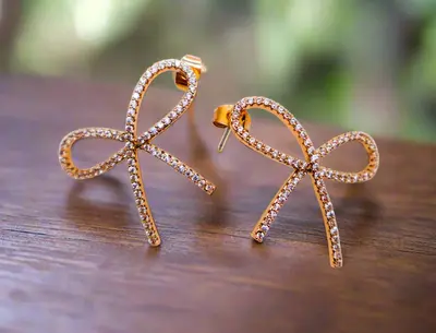 Golden Bow Tie Sparkle Earrings