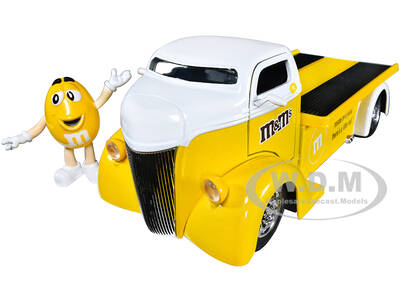 1947 Ford COE Flatbed Truck Yellow Metallic with White Top and Yellow M&M Diecast Figure \