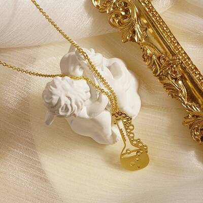 Fashionable stainless steel musical instrument pendant necklace for daily wear.