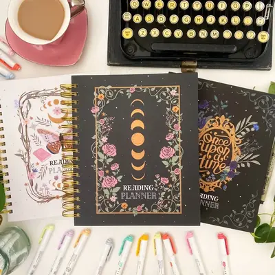 Hardcover Planner and Reading Tracker for Book Lovers to track their reading journey and plan their daily and monthly schedul...