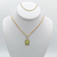 Varied turtle designs, chains, earrings, handles. High quality women's garments, accessories with 14K gold plated.