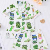 Two piece women's sleepwear set, knitted fabric, short sleeved button top, matching shorts, full body print, elegant sleepwea...