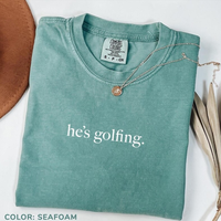 Comfort Colors He's Golfing Shirt, Golfing Season Shirt, Golfer Wife Shirt, Golfing Mom Shirt, Golf Player Shirt for Mom, Gol...