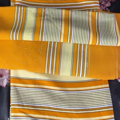 Somali Subeciyad Baati and Qafiif Garbasar Yellow Fabric with White and Blue Stripes