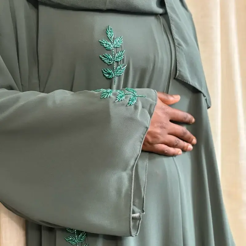 Aina Sage Green Open Abaya with Green Embroidered Leaf Design on Sleeves