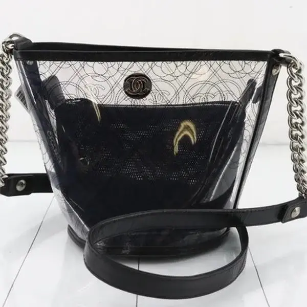 Pre-owned CHANEL PVC and Leather Shoulder Bags Crumpled Calfskin PVC Camellia Bucket Bag Series 25 for Women