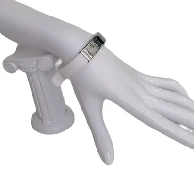 White brazalete.with engraved symbols