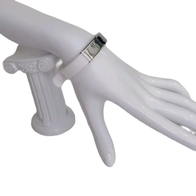 White brazalete.with engraved symbols