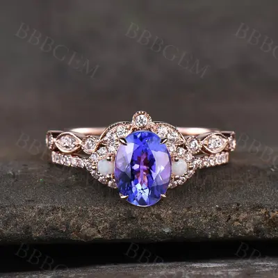 Oval Tanzanite engagement ring rose gold diamond art deco eternity band