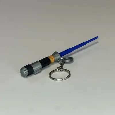 Mini Lightsaber Keychain with Retractable Blade - 3D Printed Plastic Keychain Featuring Blue Blade & Hidden Storage Cap
