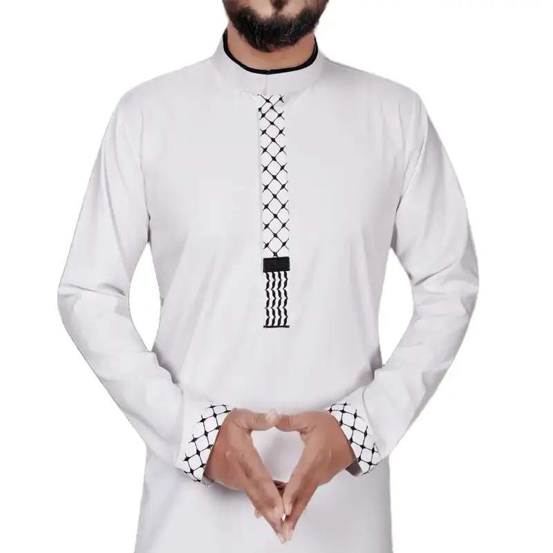 Embroidered Freedom Thobe. Premium, breathable fabric  Tailored yet relaxed fit  Minimalist design for versatile wear