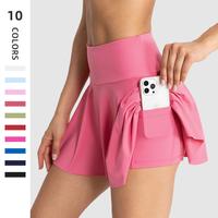 High Waist Workout Skirt with Built-in Shorts – Designed for active women, featuring a wide tummy control waistband, hidden...