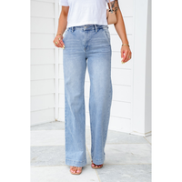 Risen High Rise Light Wash Wide Leg Jeans with Slanted Pockets