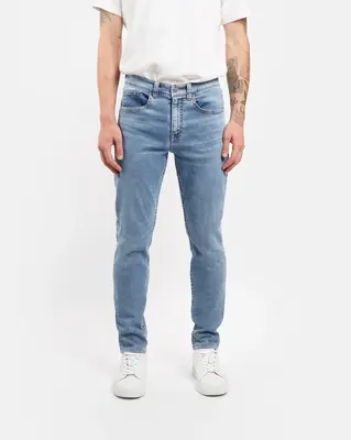 Slim fit jeans in glacier wash | Thread color: Gold | Waist rise: Low | Hem length: Cropped