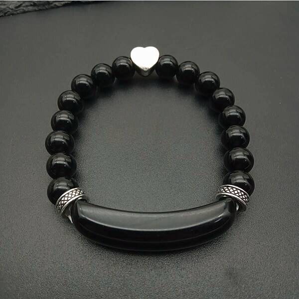 Fashionable crystal tiger eye hand bracelet with red agate heart pendant.