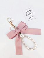 Cute Faux Pearl Decorated Wristlet Keychain, 2024 Summer & Fall Trendy Bowknot & Rhinestone Decor Keychain, Phone Wallet Key ...